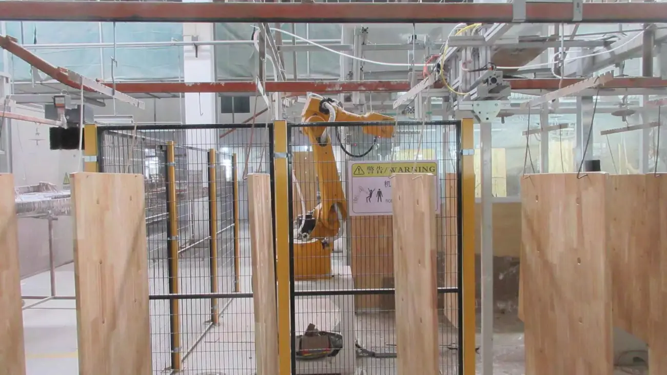 Automated robotic arm loading timber panels in wooden nursery furniture manufacturing factory (1) Automated robotic arm loading timber panels in wooden nursery furniture manufacturing factory (1)